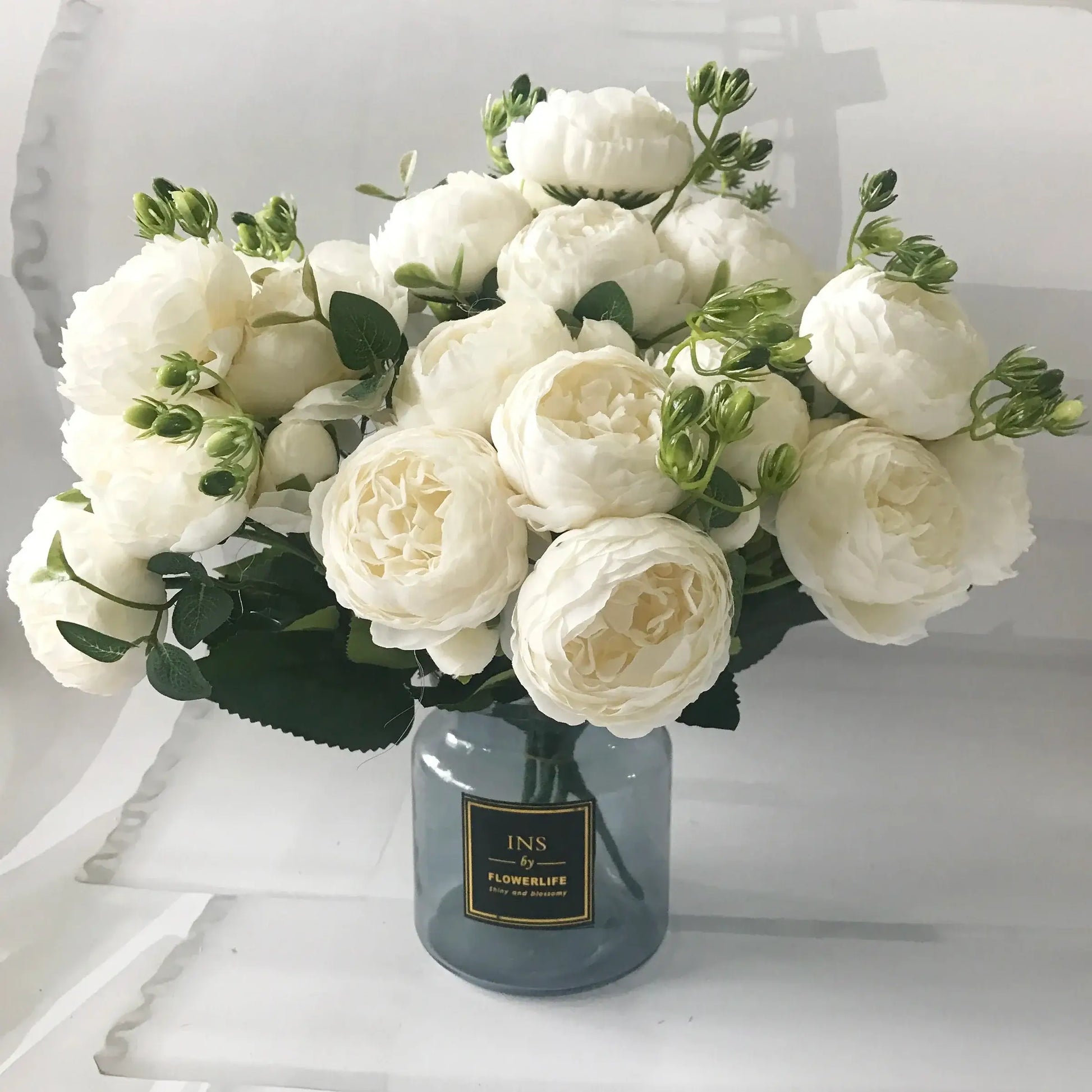 Add timeless beauty to your space with this stunning rose silk peony bouquet. Made with high-quality silk, it features 5 full peony blooms.