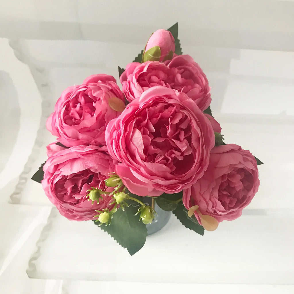 Add timeless beauty to your space with this stunning rose silk peony bouquet. Made with high-quality silk, it features 5 full peony blooms.