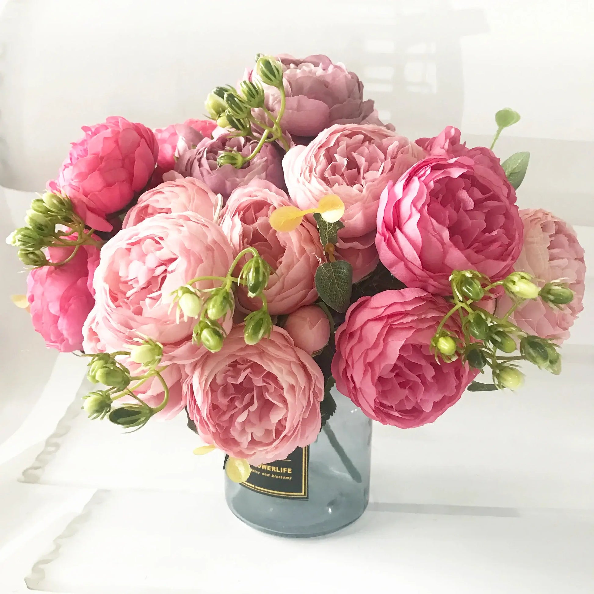 Add timeless beauty to your space with this stunning rose silk peony bouquet. Made with high-quality silk, it features 5 full peony blooms.