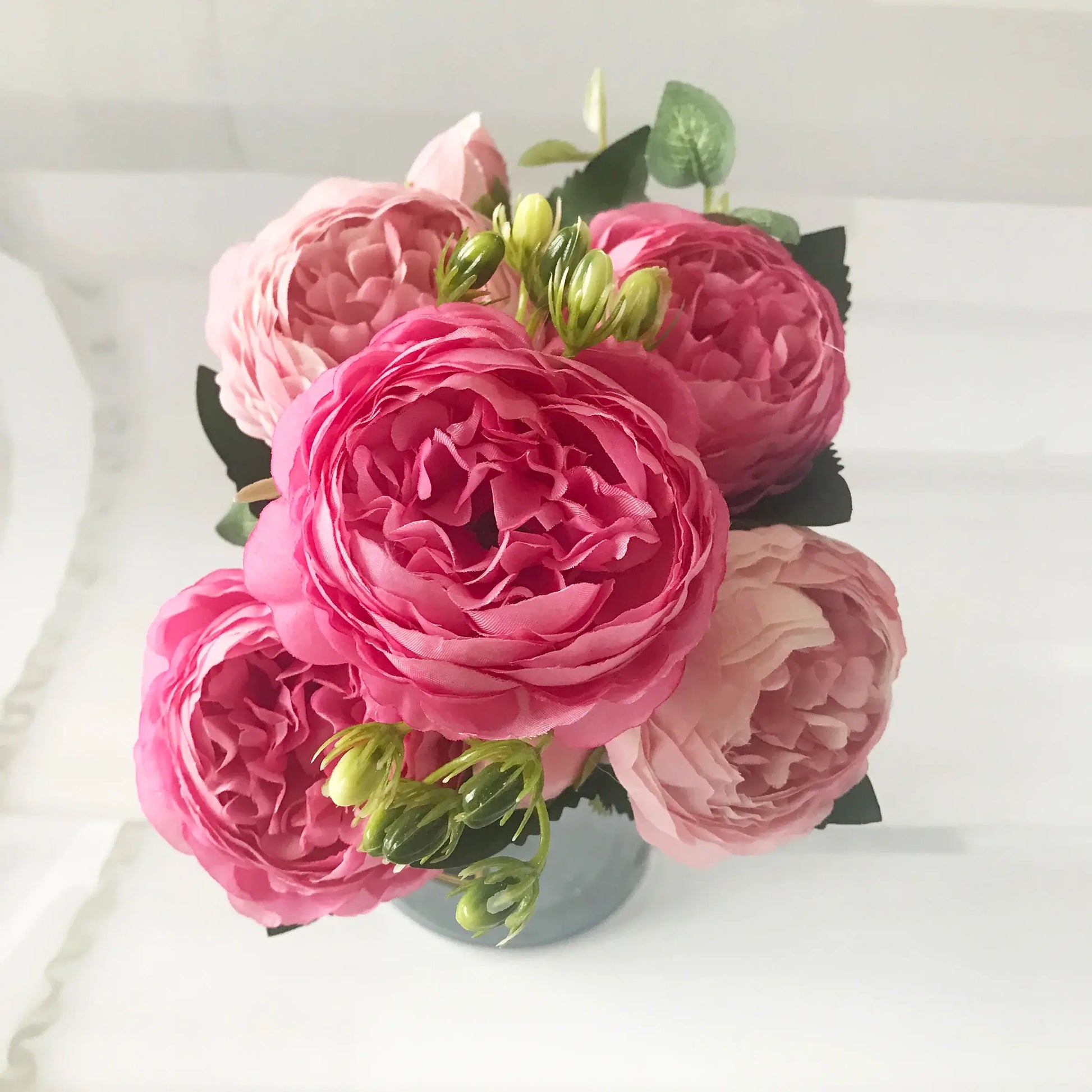 Add timeless beauty to your space with this stunning rose silk peony bouquet. Made with high-quality silk, it features 5 full peony blooms.