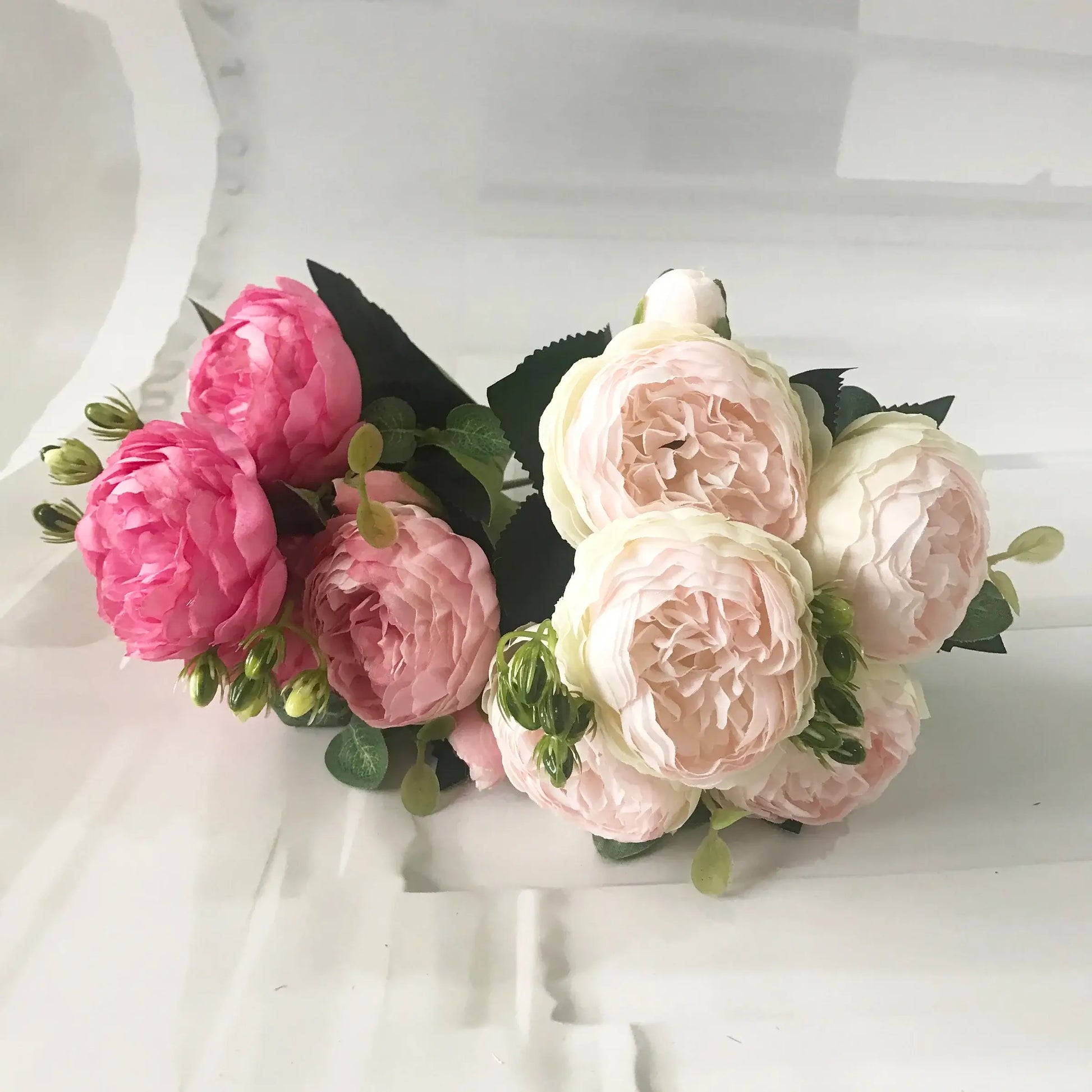 Add timeless beauty to your space with this stunning rose silk peony bouquet. Made with high-quality silk, it features 5 full peony blooms.