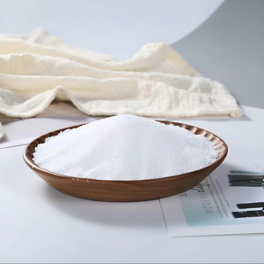 Brown ceramic bowl filled with white candle wax on a light surface with a cloth in the background