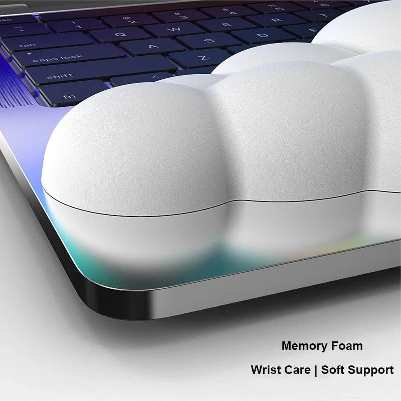 White wrist rest on a laptop keyboard with text 'Memory Foam Wrist Care | Soft Support'.
