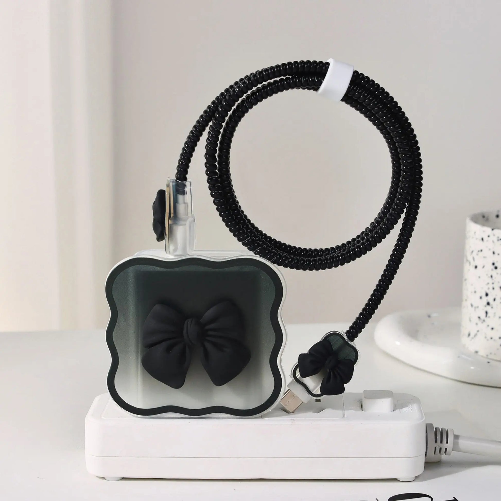 black charger head protective sleeve on a white surface.