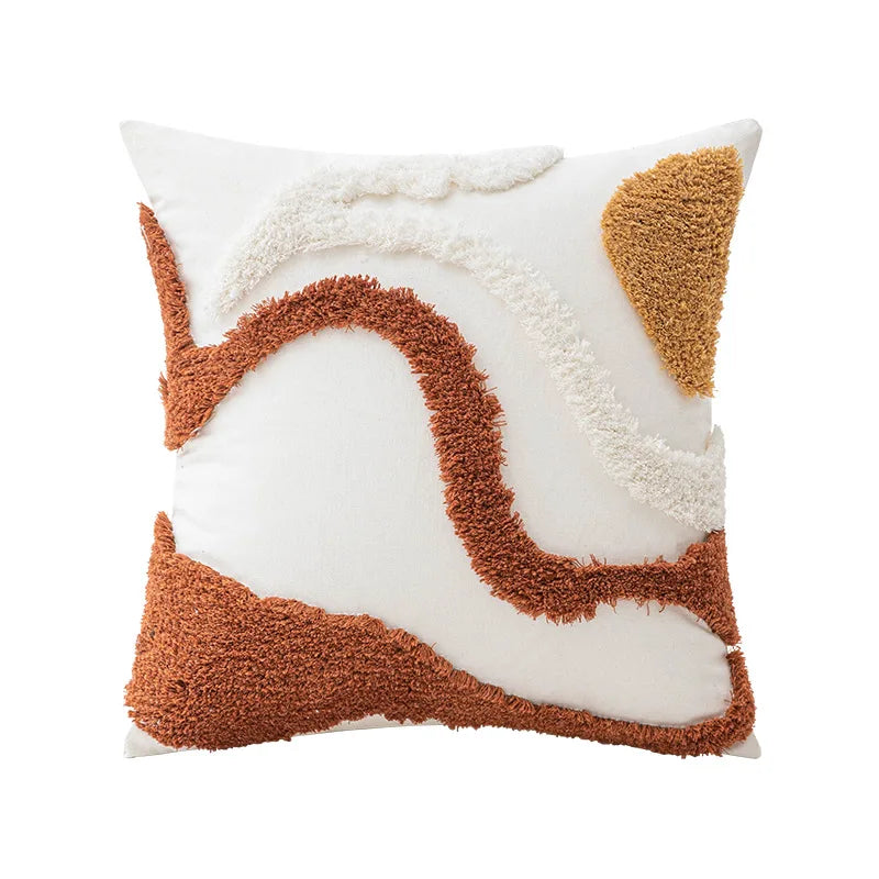 Decorative pillow with brown and white abstract pattern on a white background