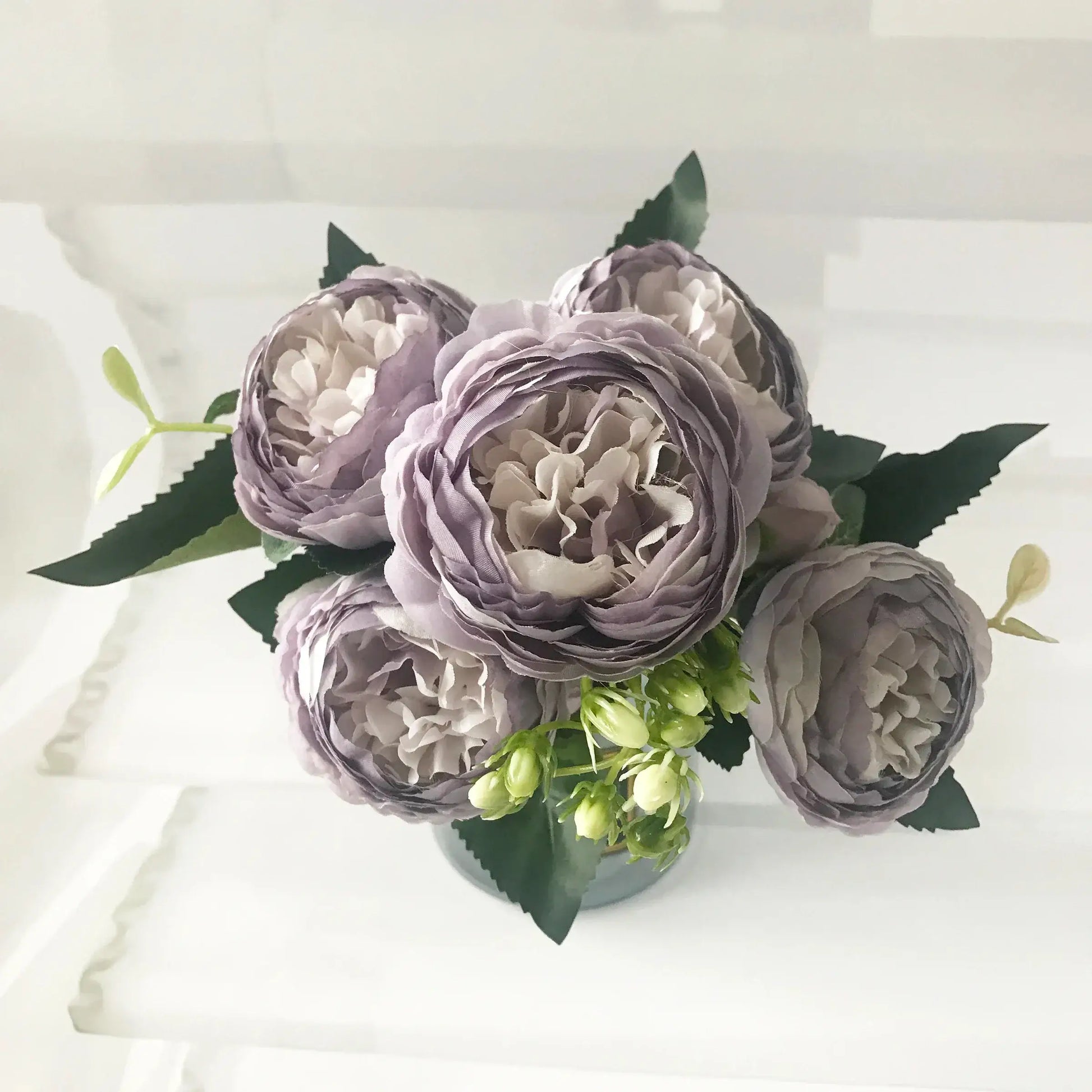 Add timeless beauty to your space with this stunning rose silk peony bouquet. Made with high-quality silk, it features 5 full peony blooms.
