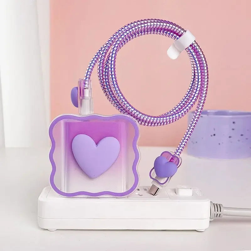 Purple heart-shaped charger head protective sleeve on a pink background