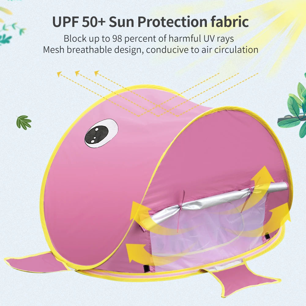 Pink shark-shaped sun shelter with UPF 50+ sun protection fabric on a light blue background.