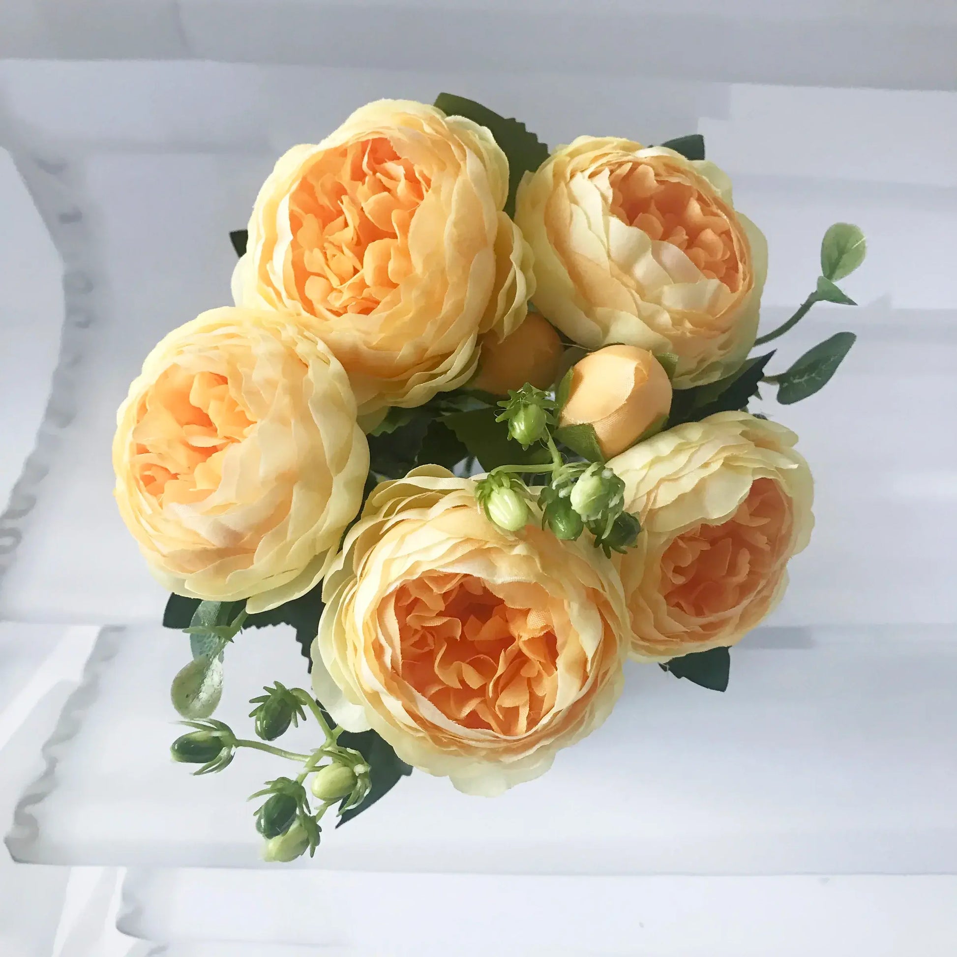 Add timeless beauty to your space with this stunning rose silk peony bouquet. Made with high-quality silk, it features 5 full peony blooms.