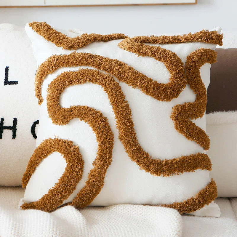 Decorative pillow with brown abstract pattern on a white background