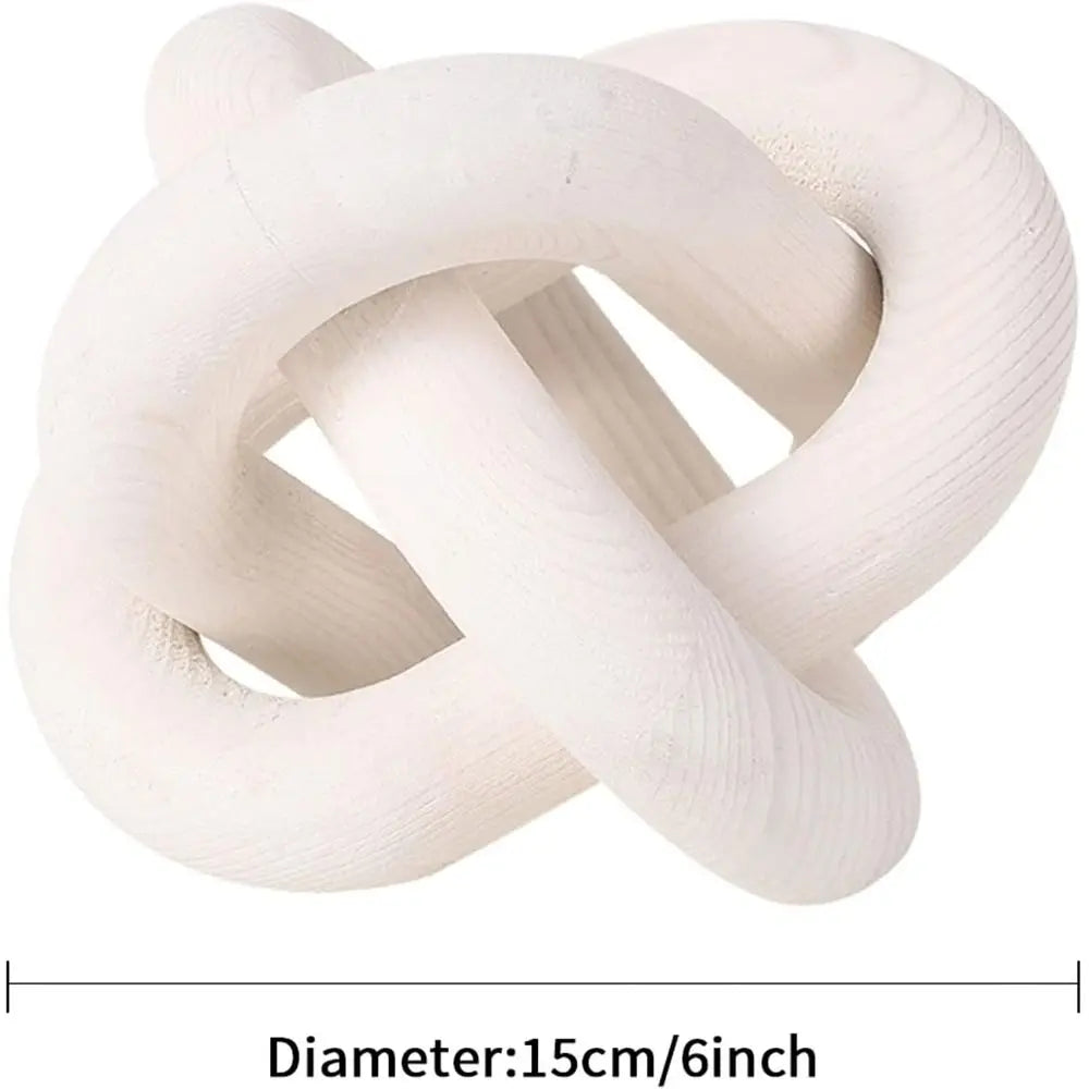 White knot-shaped object with measurement text on a white background