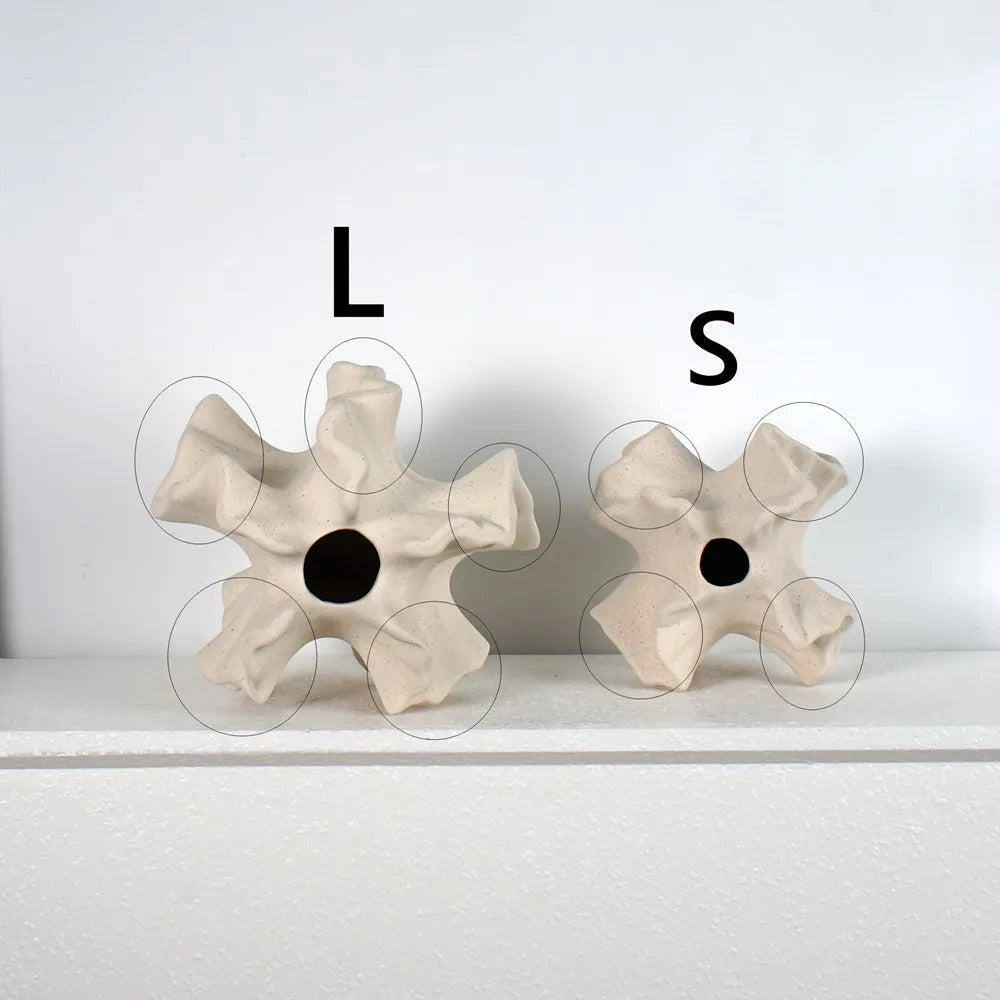 Two ceramic wall art pieces labeled 'L' and 'S' on a white background