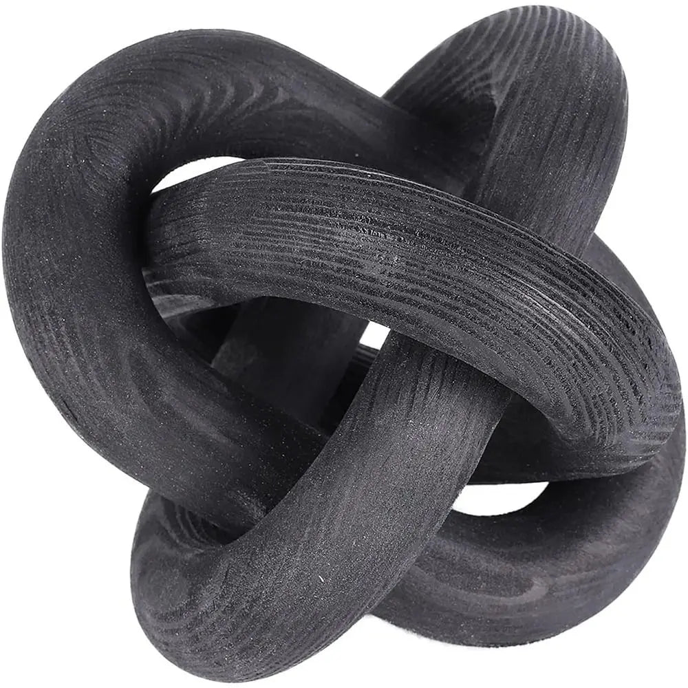 Black knot decorative sculpture on a white background