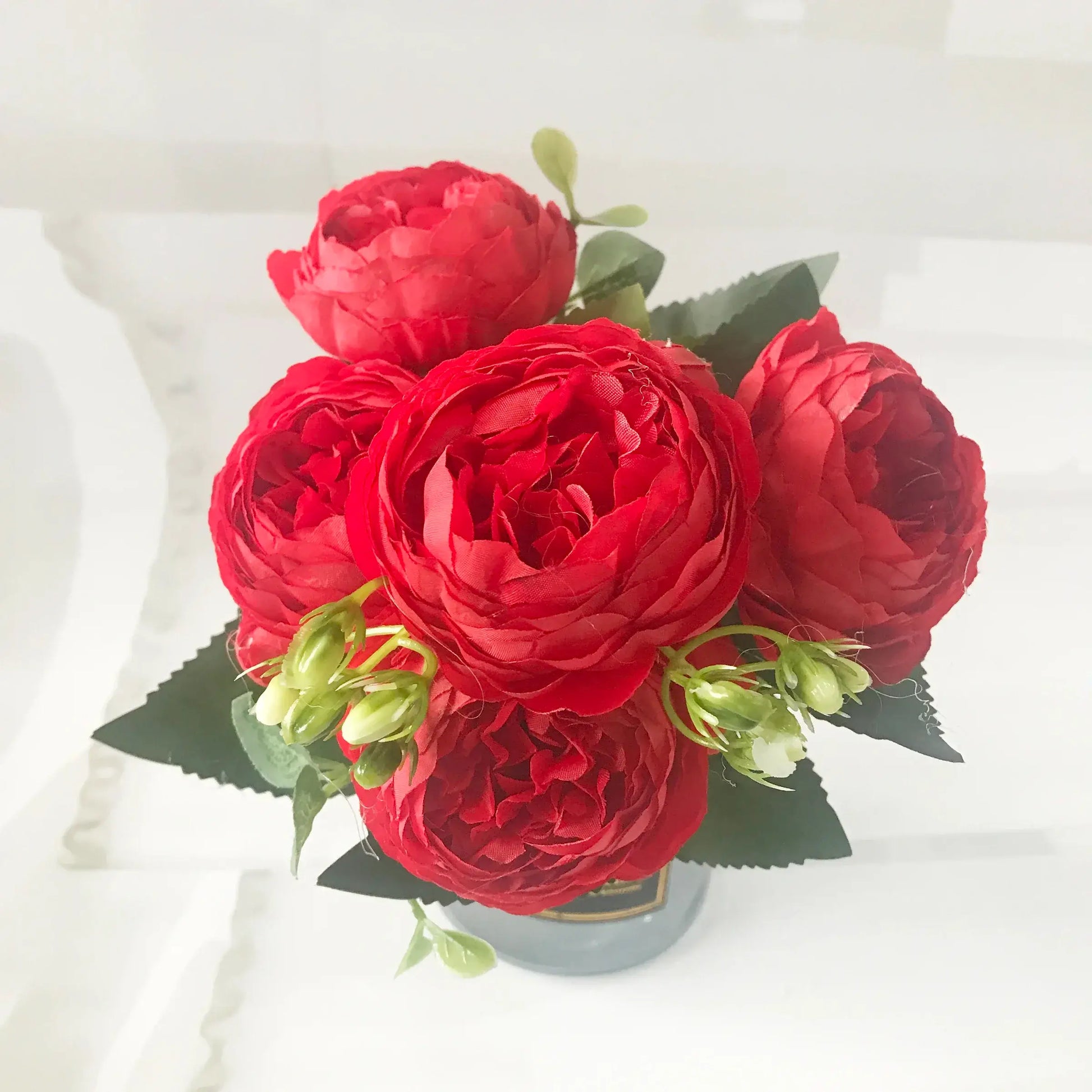 Add timeless beauty to your space with this stunning rose silk peony bouquet. Made with high-quality silk, it features 5 full peony blooms.