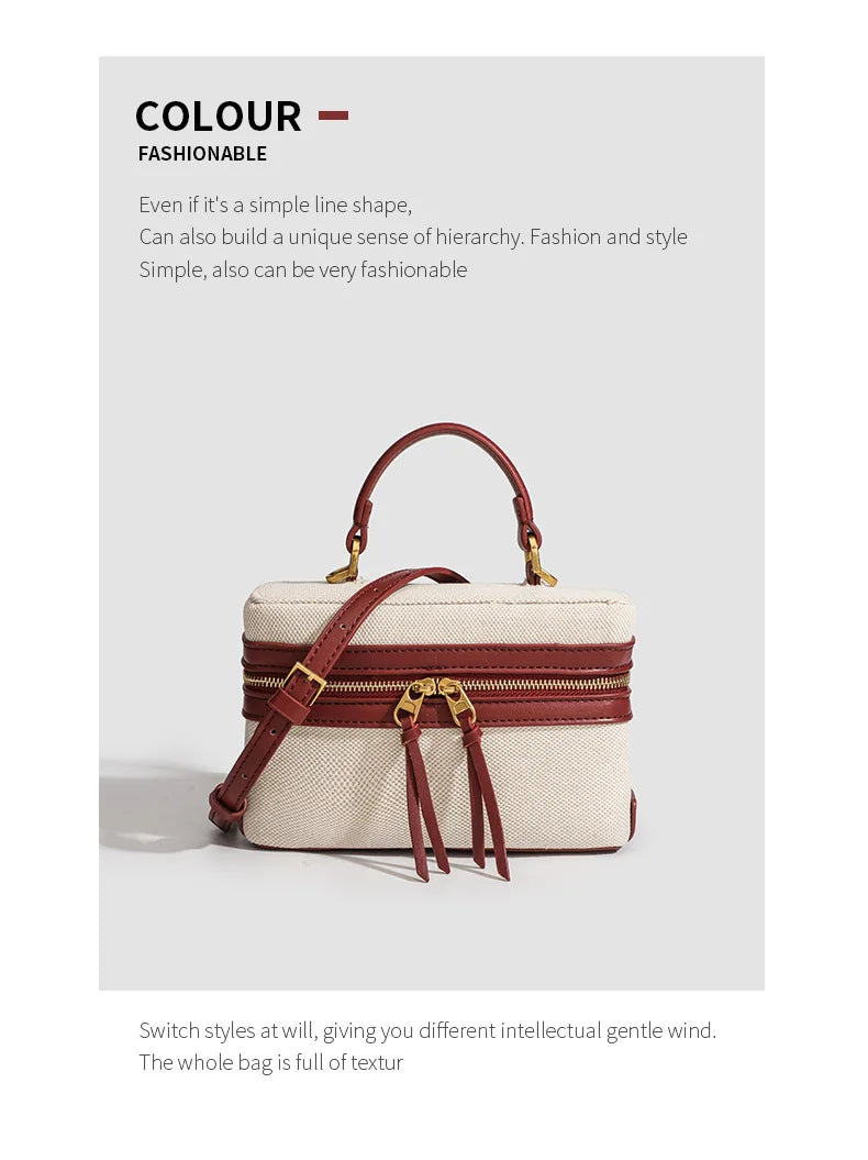 White handbag with brown leather accents on a light gray background