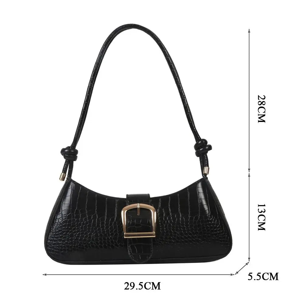 Black handbag with measurements on a white background