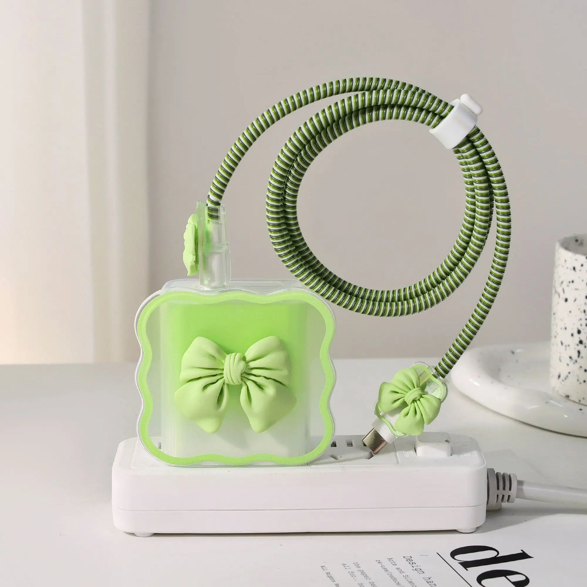 Green charger head protective sleeve on a white surface