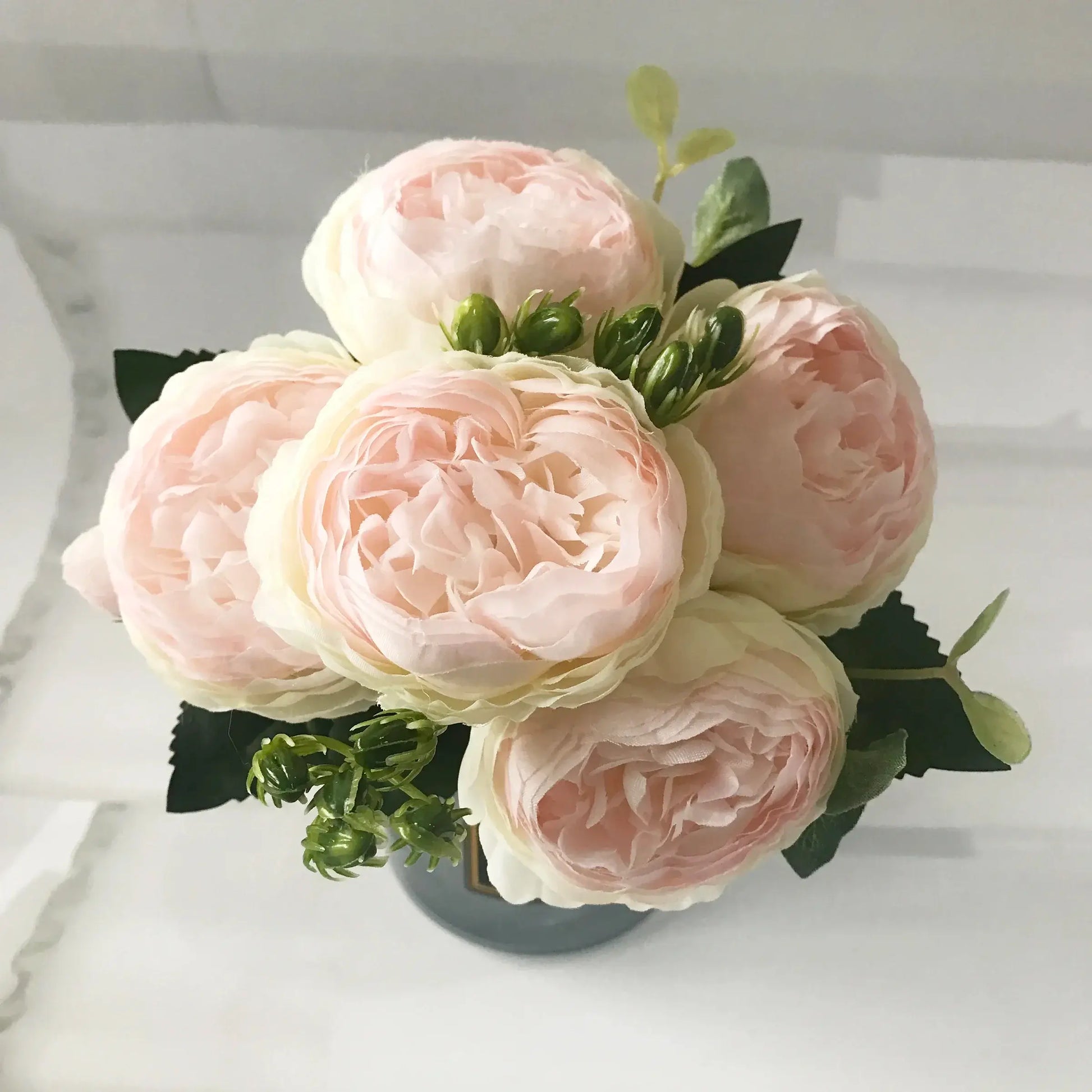 Add timeless beauty to your space with this stunning rose silk peony bouquet. Made with high-quality silk, it features 5 full peony blooms.
