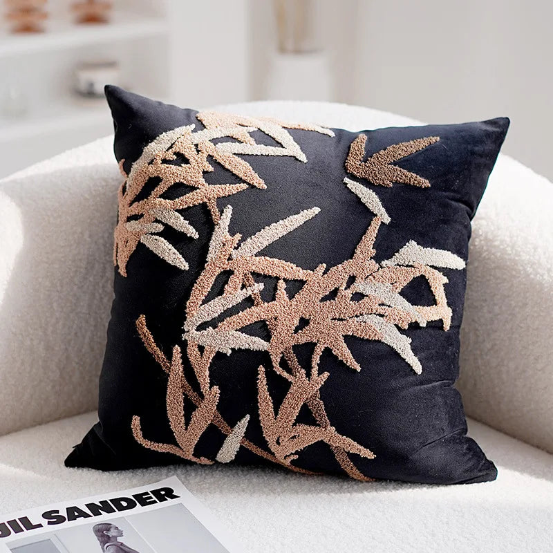 Decorative pillow with leaf pattern on a couch