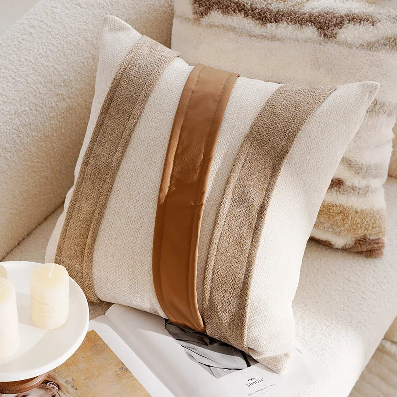 Decorative pillow with brown and beige stripes on a couch