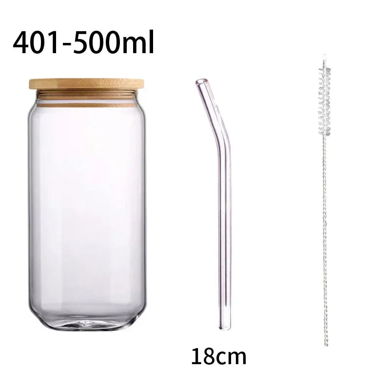 Clear glass jar with bamboo lid, glass straw, and cleaning brush on a white background