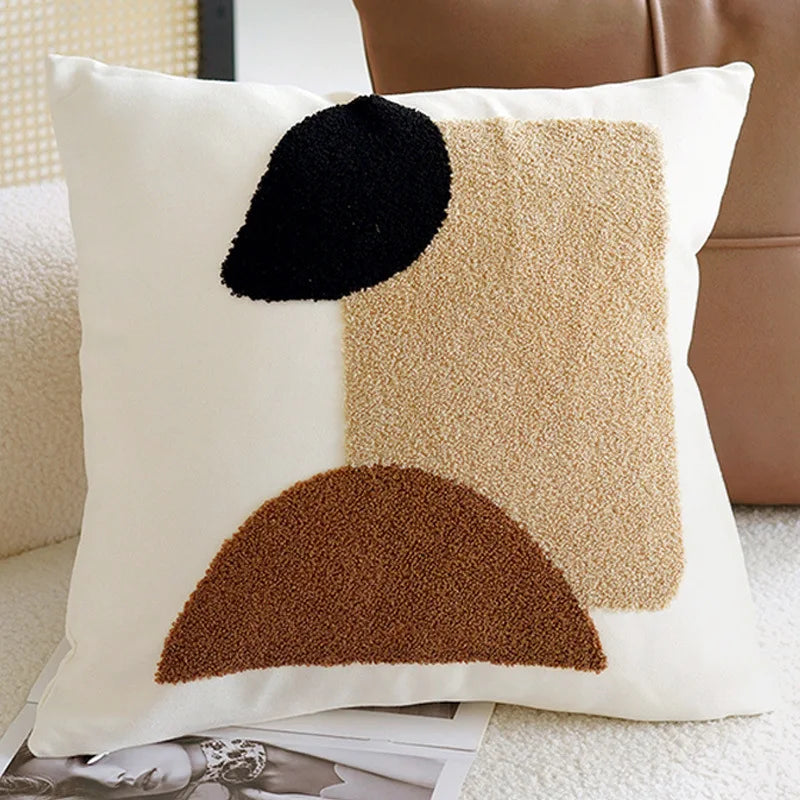 Decorative pillow with abstract shapes on a couch