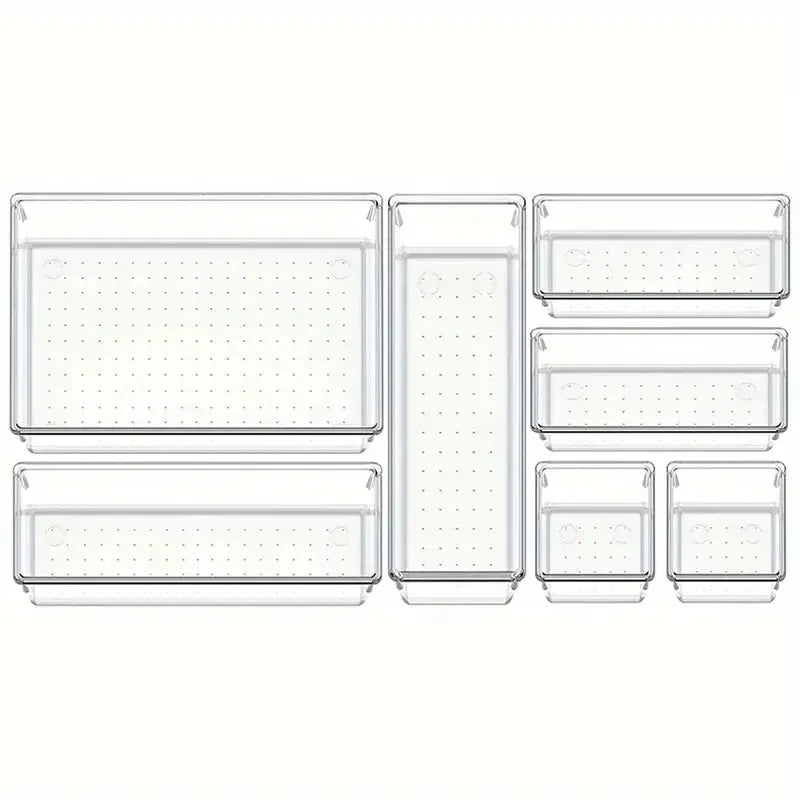 Set of clear plastic drawers with perforated designs on a white background