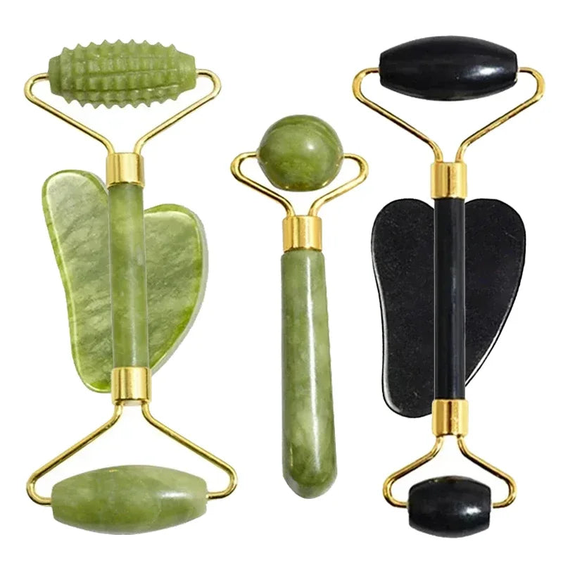 Two sets of jade rollers, one green and one black, on a white background.