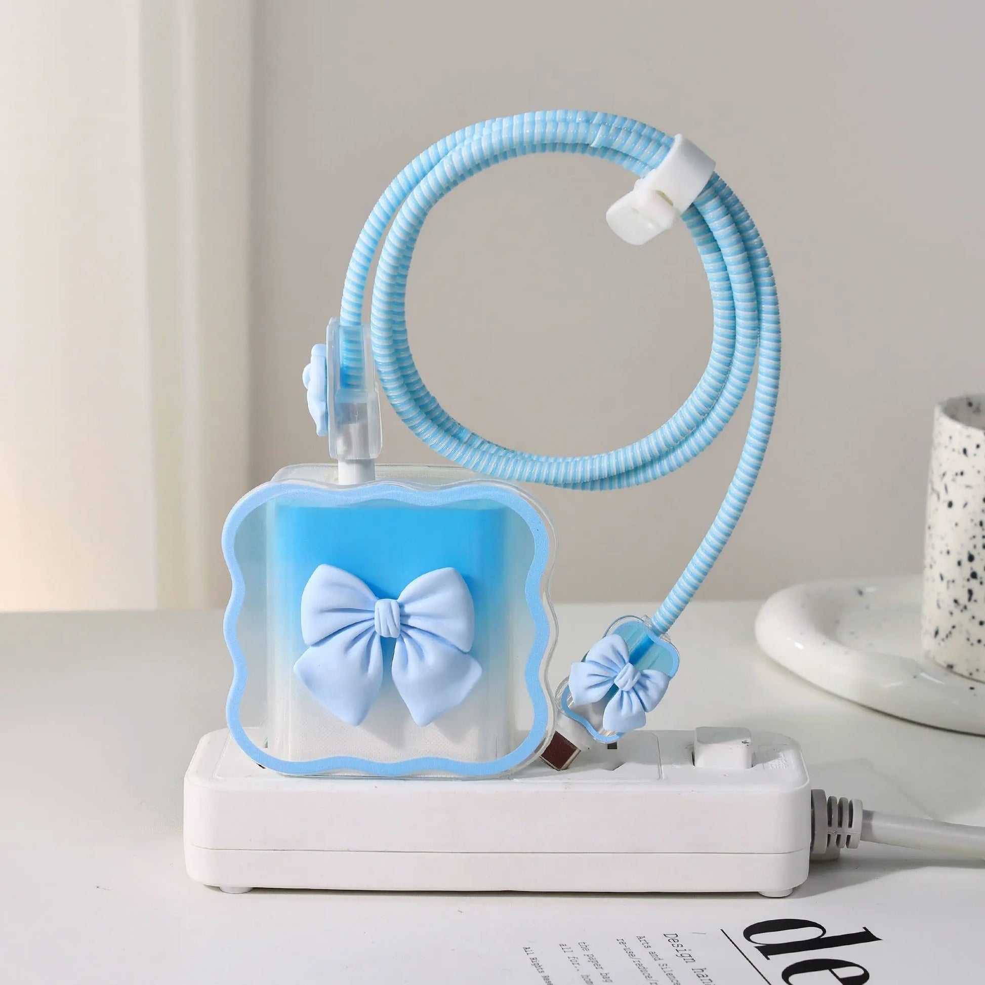 Blue charger head protective sleeve on a white surface