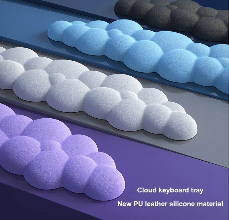 Cloud-shaped keyboard tray with blue, white, and purple colors on a gradient background.