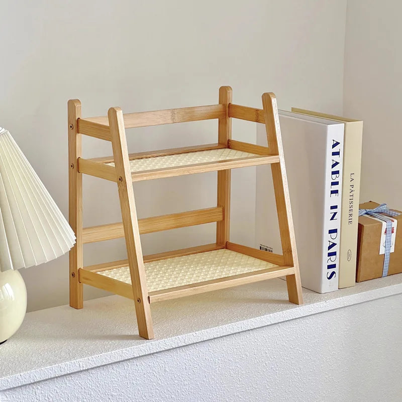 Wooden shelf with woven seat and backrest on a light gray floor.