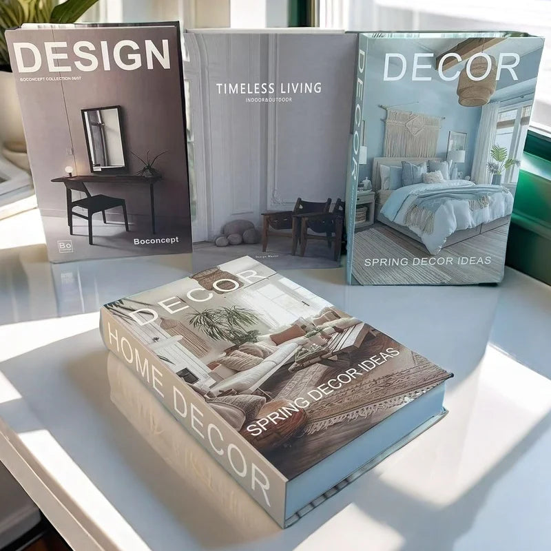 Three books on home decor and design on a reflective surface with a blurred indoor setting.
