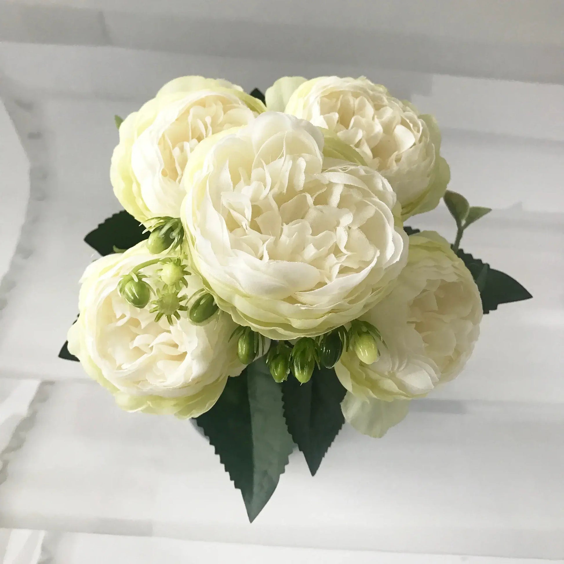 Add timeless beauty to your space with this stunning rose silk peony bouquet. Made with high-quality silk, it features 5 full peony blooms.