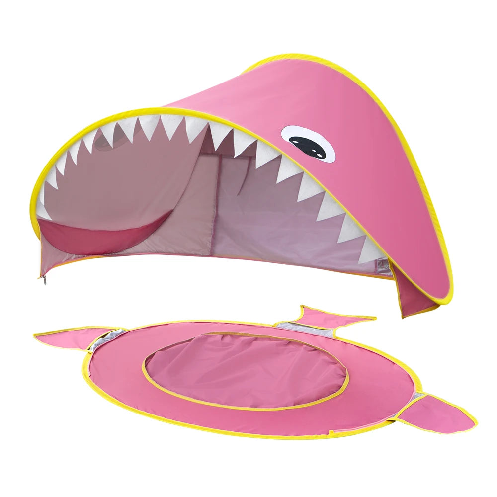 Pink shark-shaped tent with open mouth on a white background