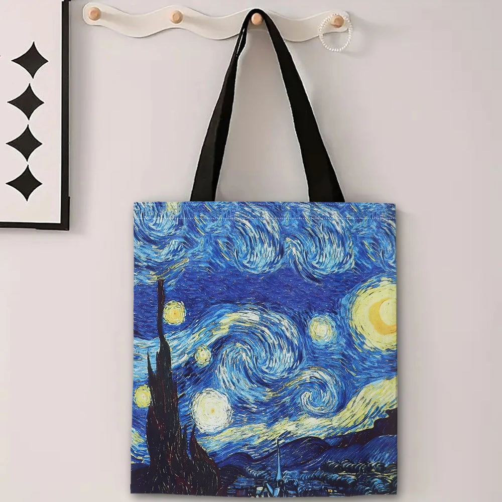 Tote bag with 'Starry Night' design hanging on a wall