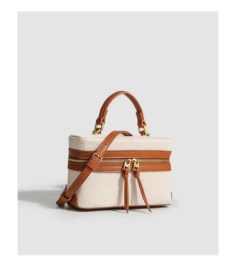 Canvas handbag with brown leather accents on a white background, featuring the brand 'FASHIONABLE'.