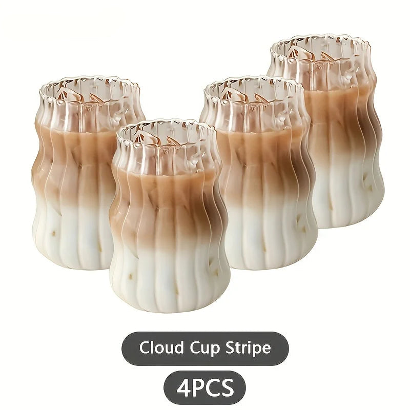 Set of four cloud cup stripe glasses with a gradient design on a white background.