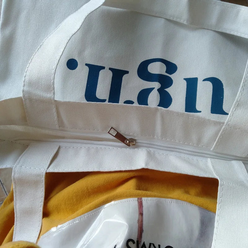 White bag with blue text 