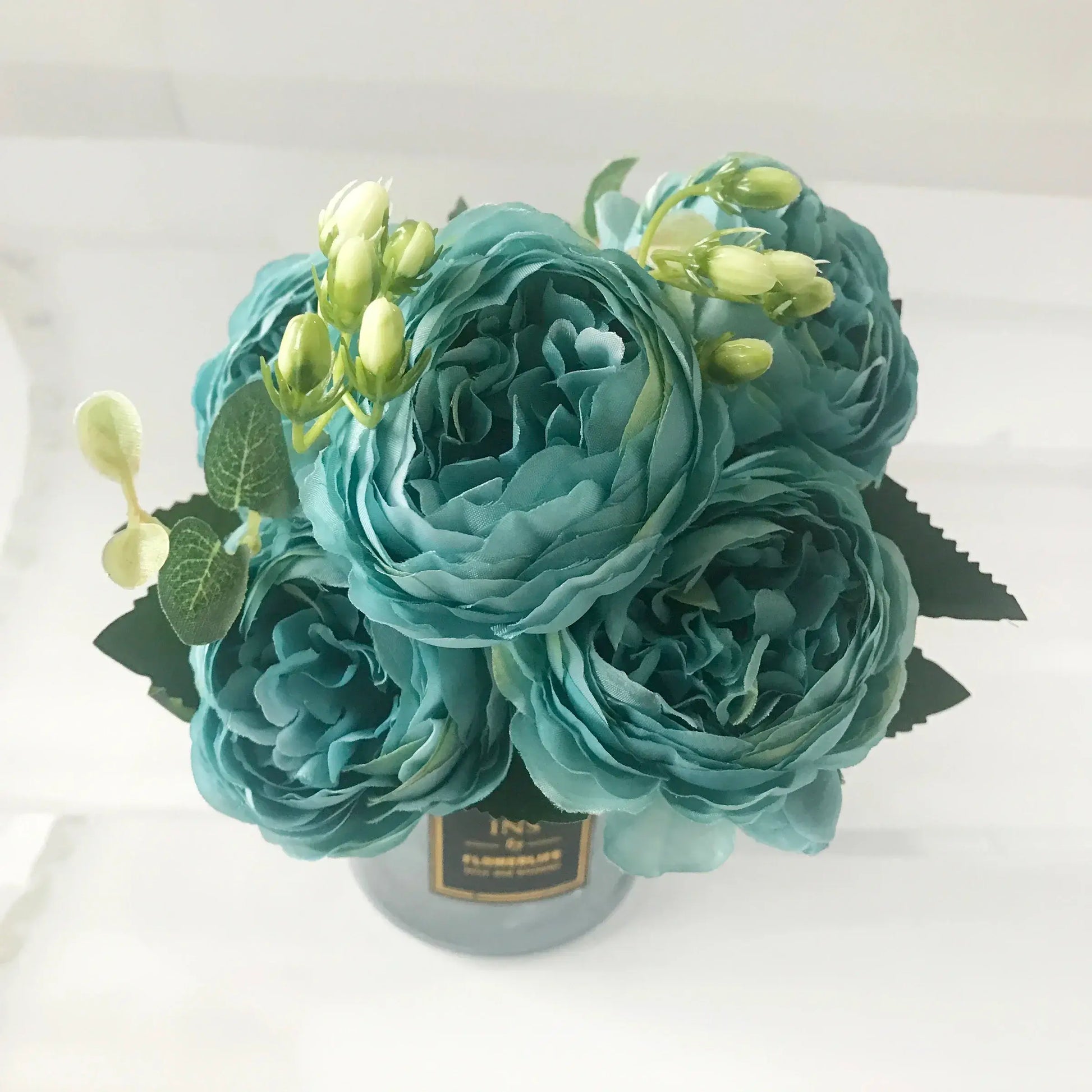 Add timeless beauty to your space with this stunning rose silk peony bouquet. Made with high-quality silk, it features 5 full peony blooms.
