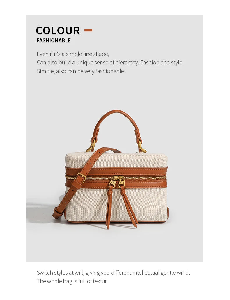 Handbag with brown leather straps on a white background