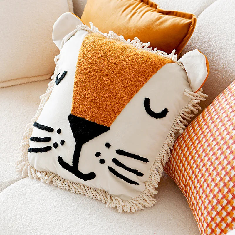 Decorative pillow with a fox face design on a couch
