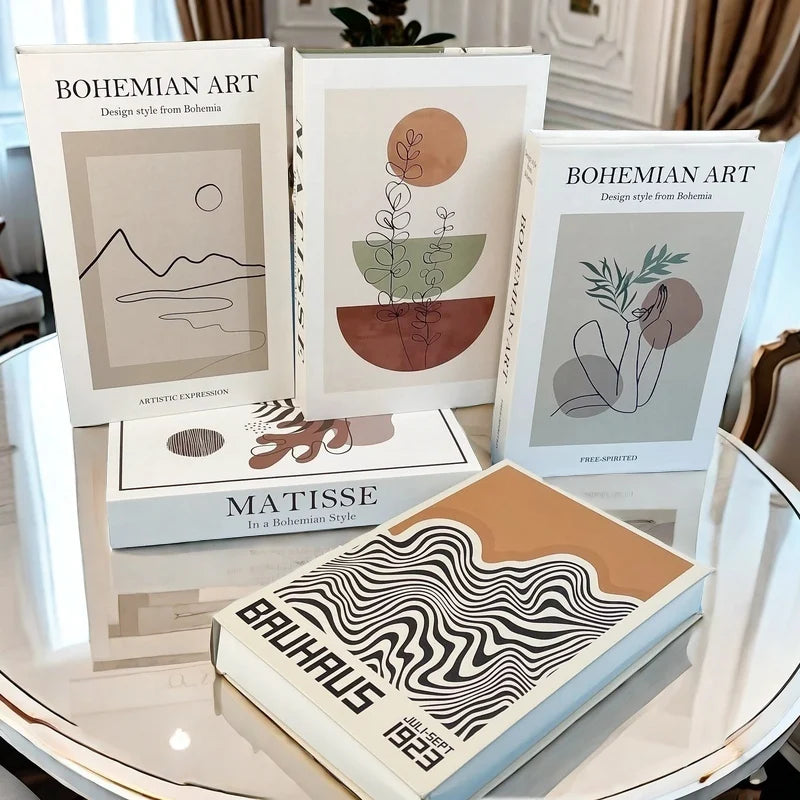 Collection of art books on a table with 'Bohemian Art' and 'Matisse' titles.