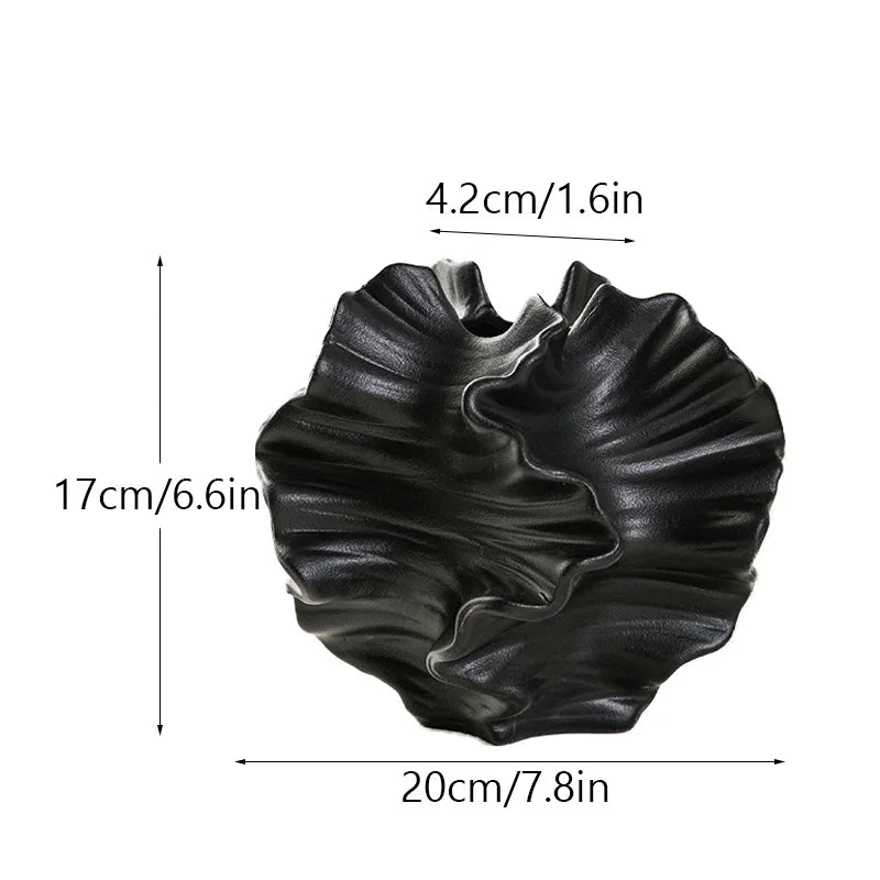 Black decorative vase with measurements on a white background